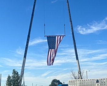 Two of our Cranes holding the precious United States Flag
